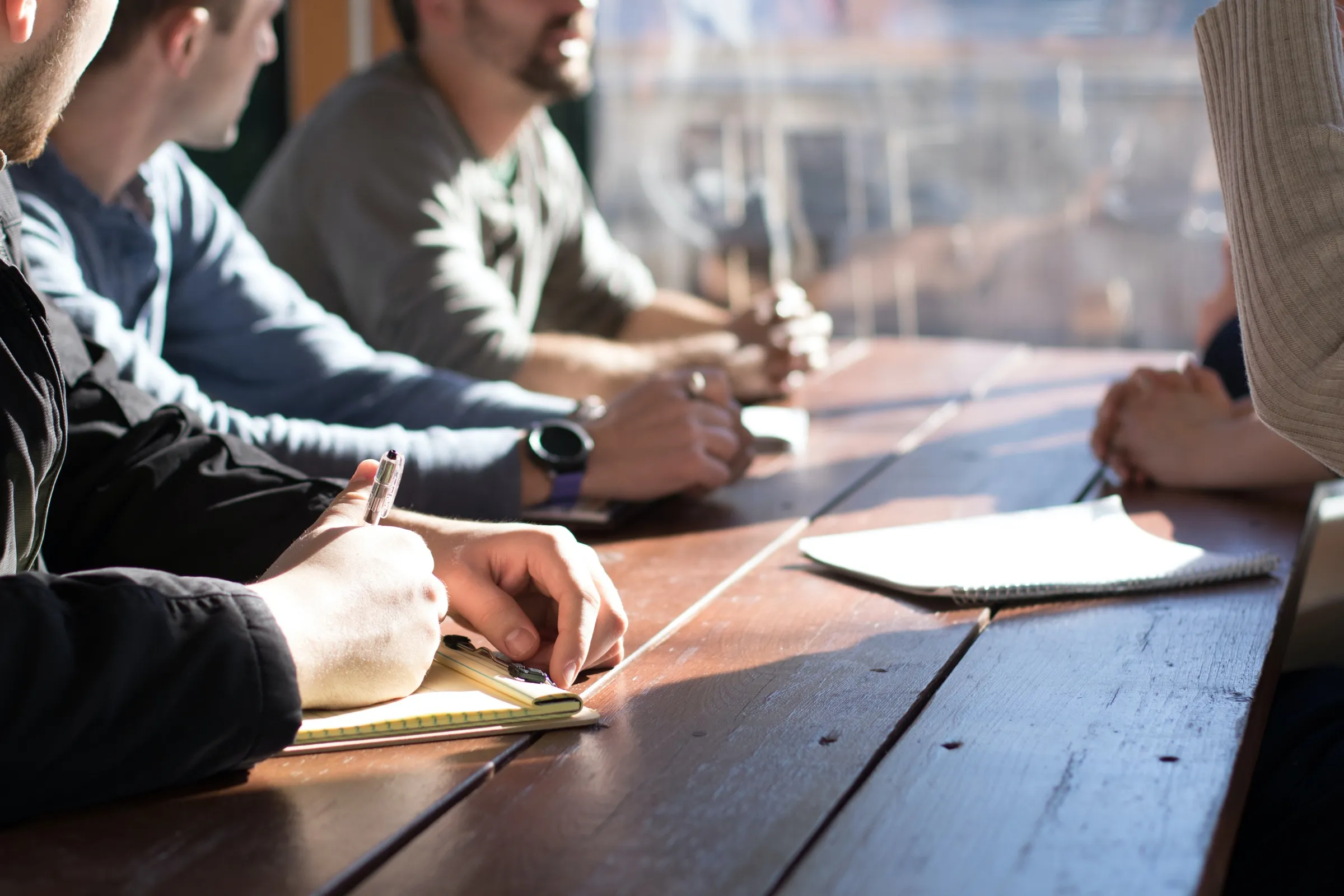 Business meeting around a boardroom table