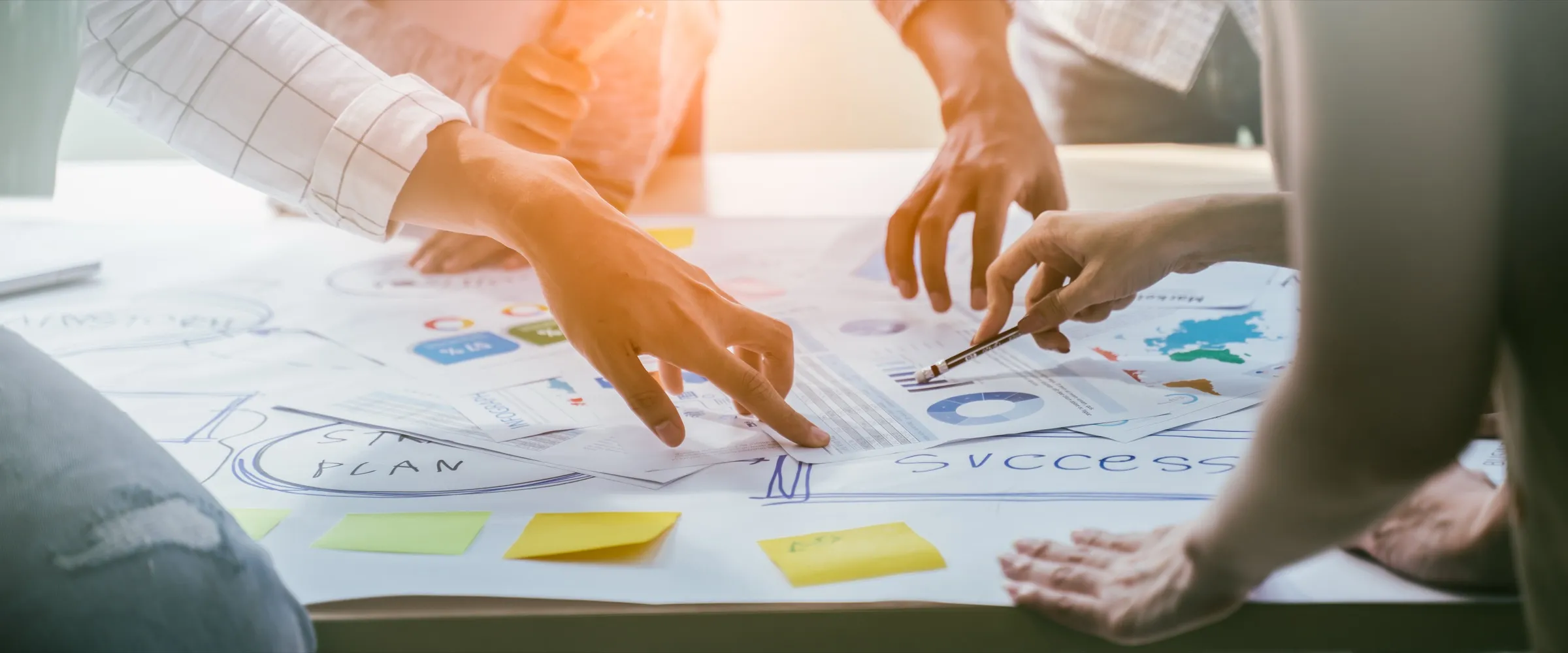 Consultants mapping out a business strategy on a table