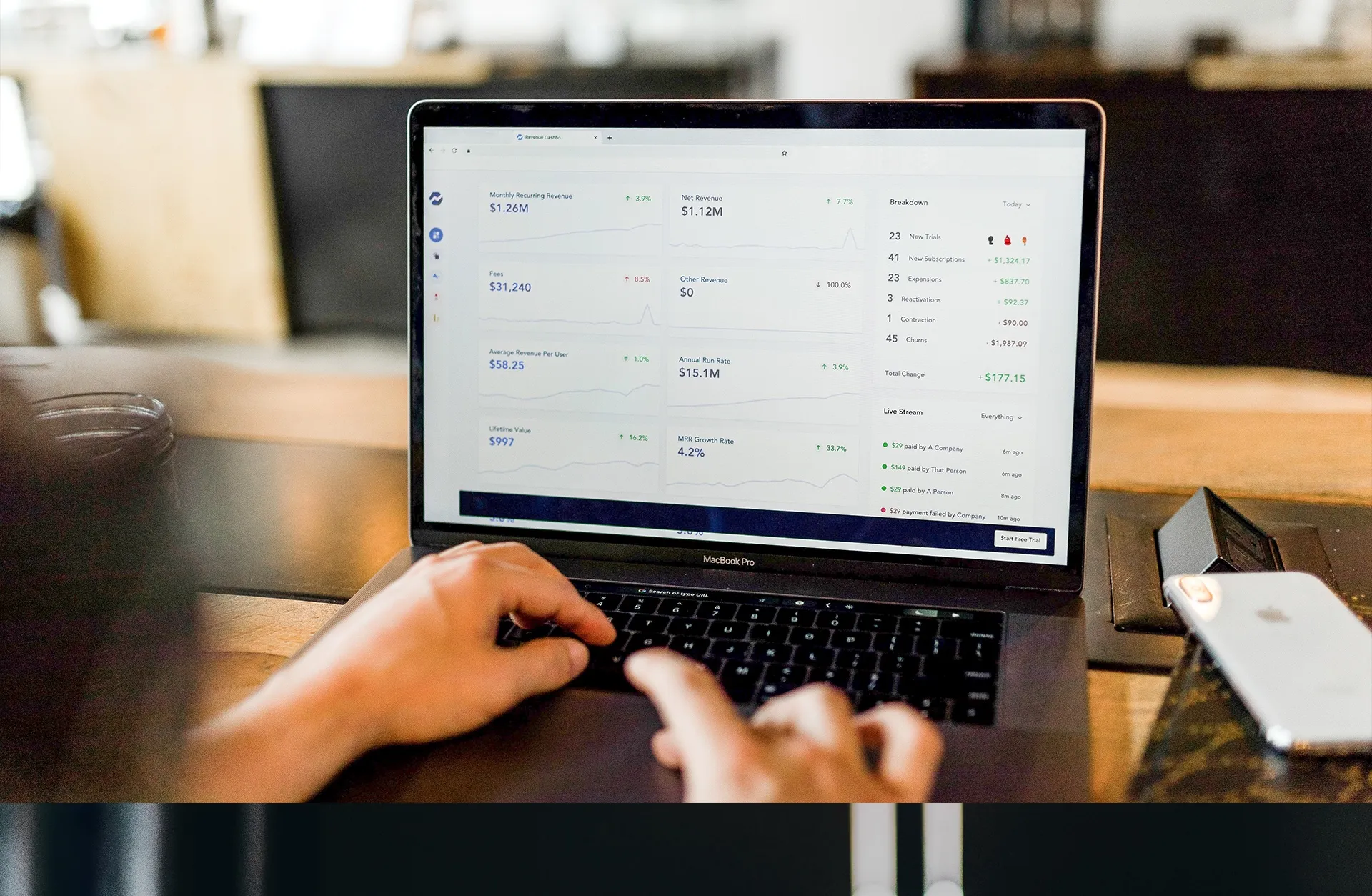 Business adviser reviewing figures on a laptop